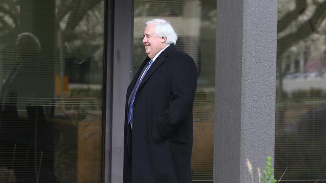 Clive Palmer leaves the PUP offices in Canberra. He has done a deal which will repeal the mining tax. Picture: Gary Ramage