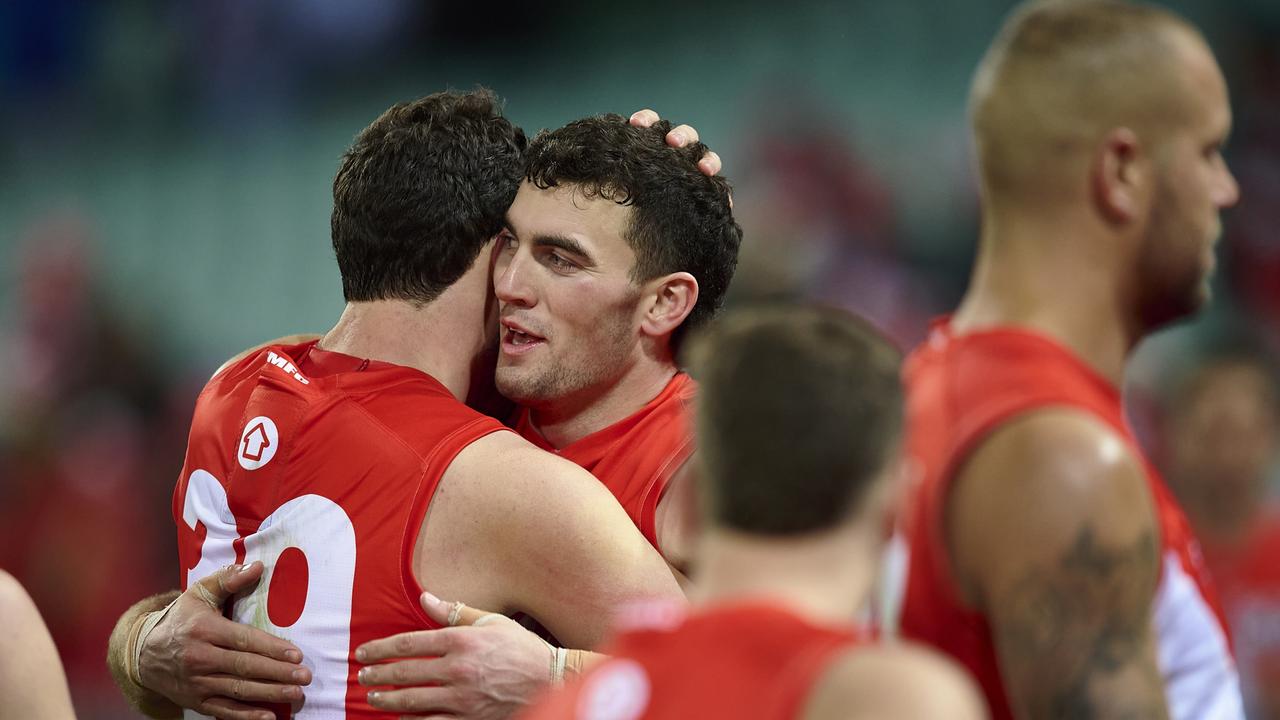 Tom McCartin celebrates victory with Paddy McCartin after thrashing the Western Bulldogs.