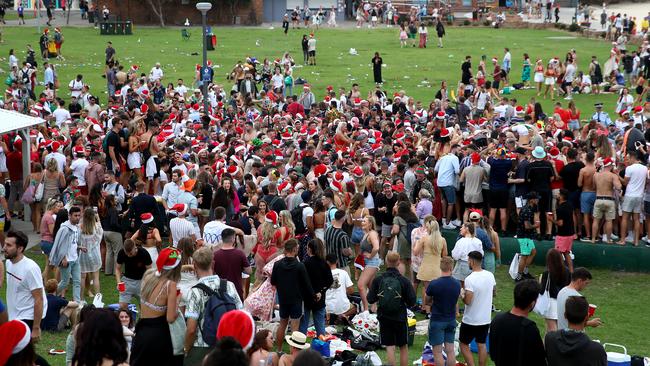 A crowd of mostly backpackers hold an impromptu party at Bronte Beach on Christmas Day. Picture: Toby Zerna