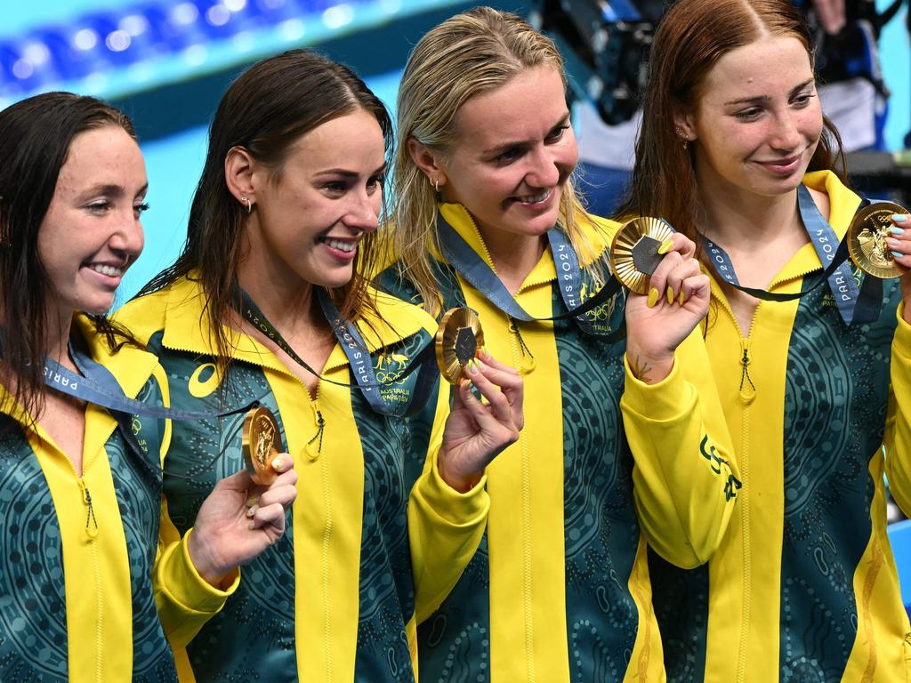 Mollie O’Callaghan (far right) with Lani Pallister, Brianna Throssell and Ariarne Titmus (second from right) with their medals after the final of the women's 4x200m freestyle relay in Paris. Picture: AFP