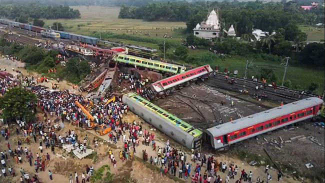 AFPTV video footage showing people at the accident site of a three-train collision near Balasore. Picture: AFP