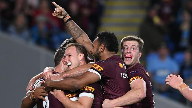 GOLD COAST, AUSTRALIA - JULY 14: Ben Hunt of the Maroons celebrates with teammates after scoring his second try during game three of the 2021 State of Origin Series between the New South Wales Blues and the Queensland Maroons at Cbus Super Stadium on July 14, 2021 in Gold Coast, Australia. (Photo by Bradley Kanaris/Getty Images)