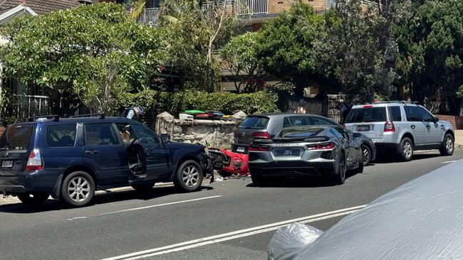 The scene of the crash with the red Vespa on the ground. Picture: Supplied