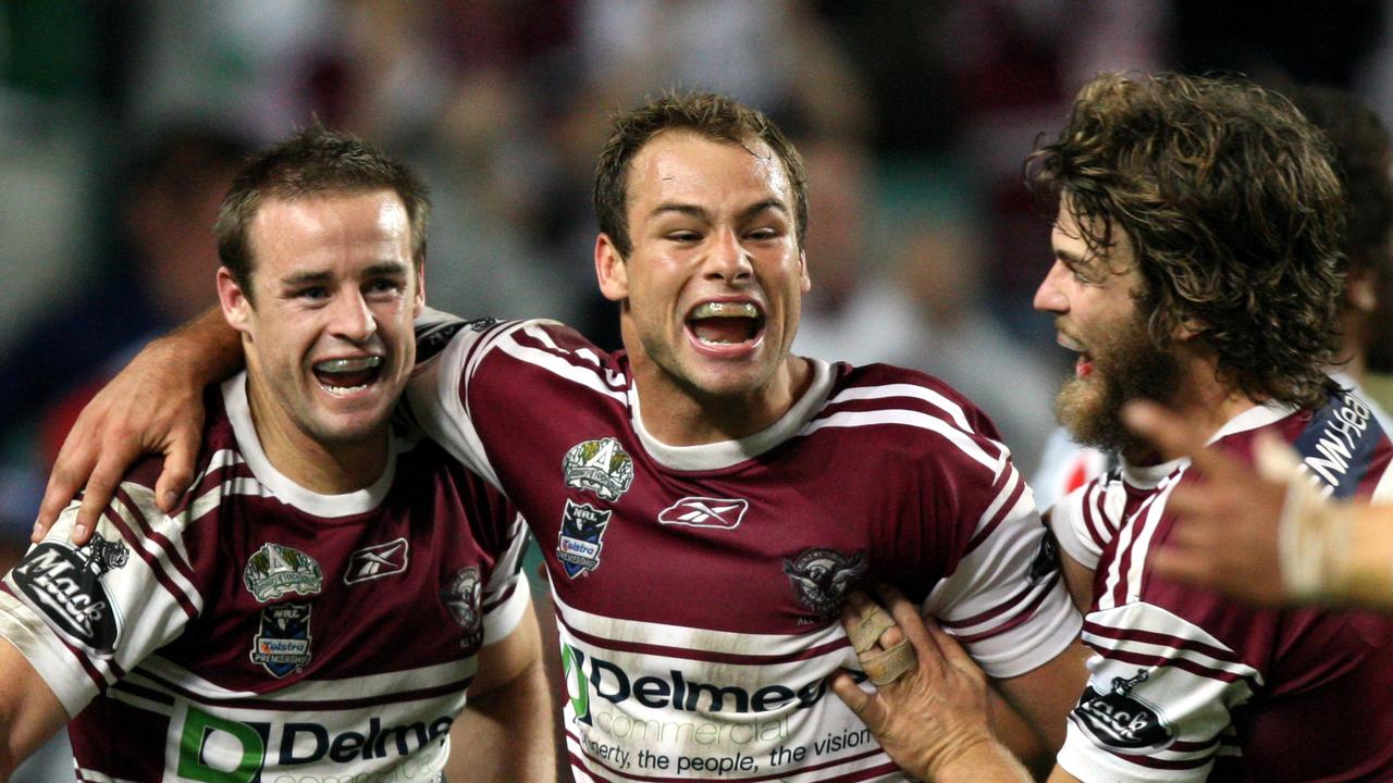 Michael Robertson celebrates his try with Brett Stewart and David Williams