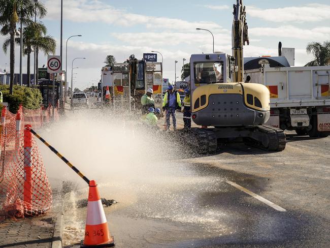 Burst Water Main, South Road, Daws Road corner in front of Shell petrol station, Tuesday April 9, 2019, pumping water from the hole in the road - pic AAP/MIKE BURTON