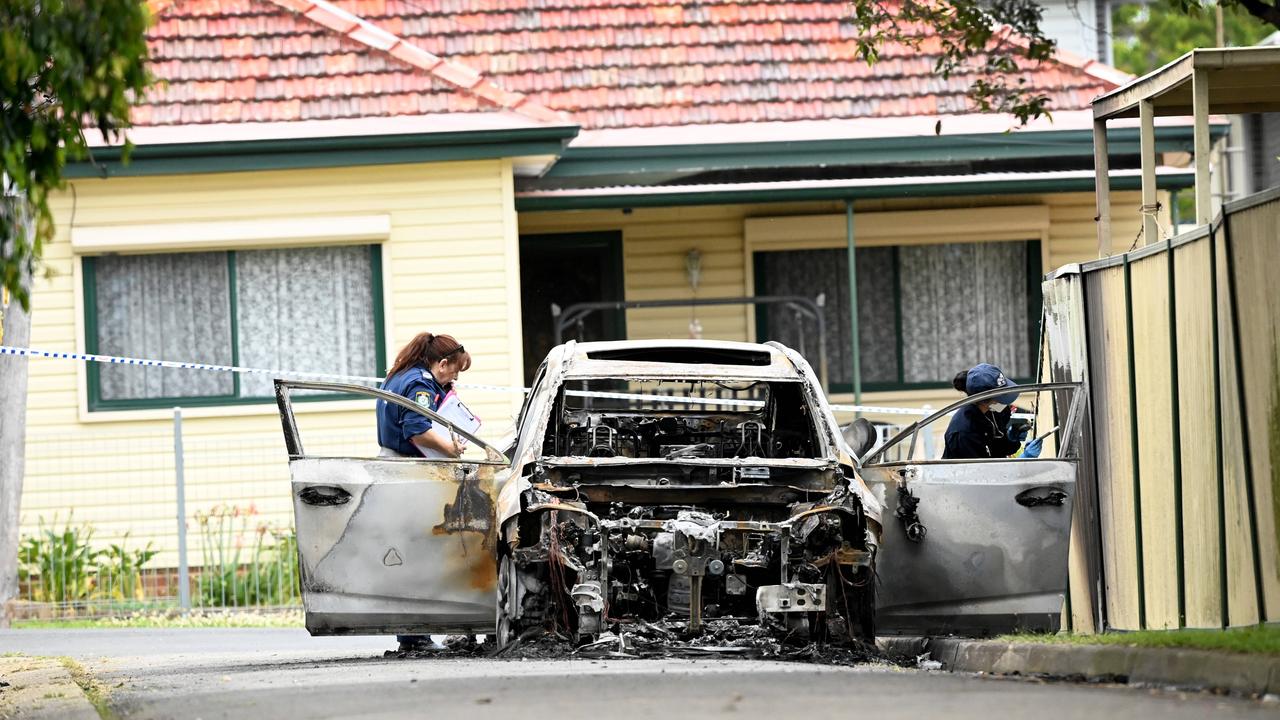 The burnt-out car that is believed to be involved in the shooting deaths of two Hamze family members in Guildford this morning. Picture: NCA NewsWire/Jeremy Piper