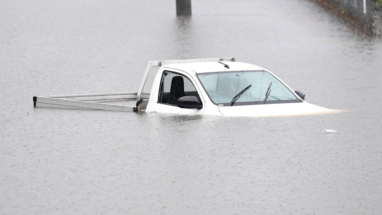 A vehicle is submerged in flood water on February 26, 2022 in the suburb of Oxley in Brisbane. (Photo by Dan Peled/Getty Images)