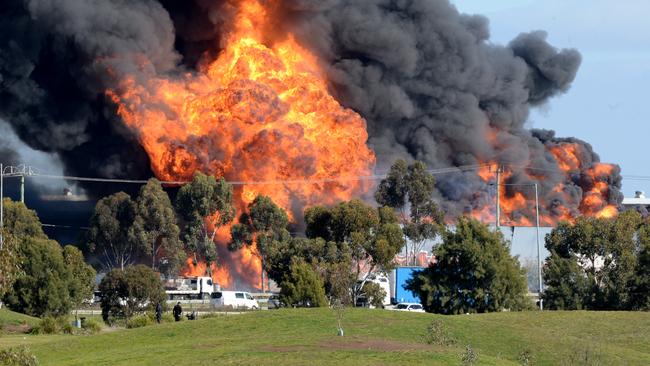 Flames and thick smoke from a factory fire in Derrimut. Picture: NewsWire / Andrew Henshaw