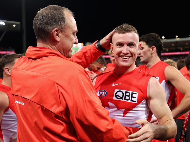 John Longmire embraces Chad Warner after a Swans win. Picture: Cameron Spencer/Getty Images