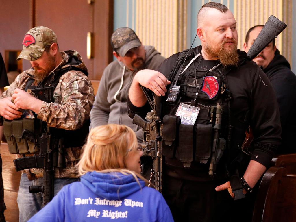 William Null (right), one of 14 men accused of plotting to kidnap the governor, stands in the gallery of the Michigan Senate Chamber during a rally demanding the reopening of businesses. Picture: Jeff Kowalsky/ AFP