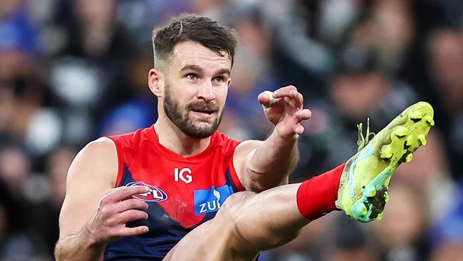 MELBOURNE, AUSTRALIA - JUNE 12: Joel Smith of the Demons kicks the ball during the 2023 AFL Round 13 match between the Melbourne Demons and the Collingwood Magpies at the Melbourne Cricket Ground on June 12, 2023 in Melbourne, Australia. (Photo by Dylan Burns/AFL Photos)