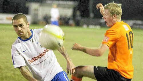 Woombye defeated Buderim 3 to 1 at Ballinger Park. Woombye’s Arron Buckley challenges Buderim’s Shaun Callanan. Picture: Barry Leddicoat