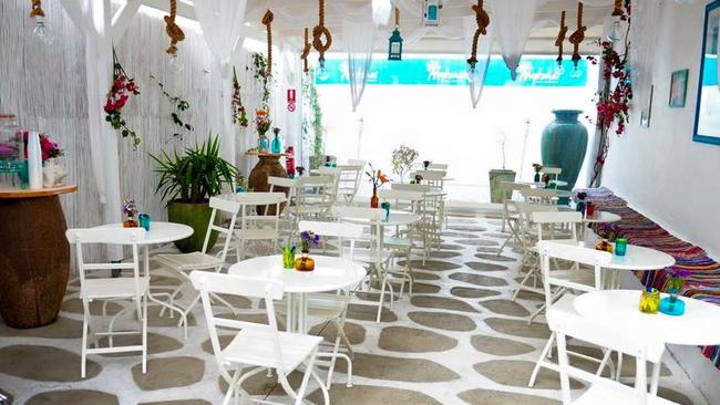 Mykonos Cafe features cobble stone, white furniture and ocean blue artwork. Picture: Facebook