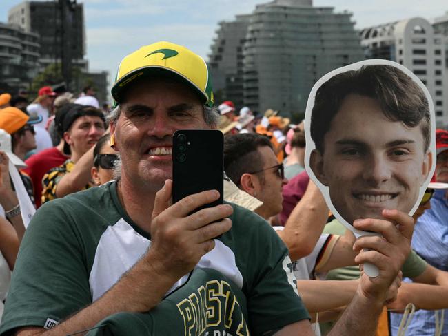 A fan holds a cutout of Oscar Piastri. Picture: AFP