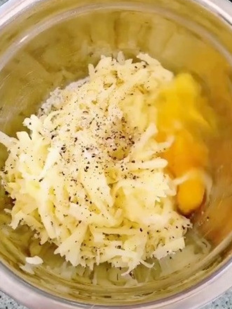 Season the dry, shredded potato and mix in an egg. Picture: TokTok / Poppy Cooks