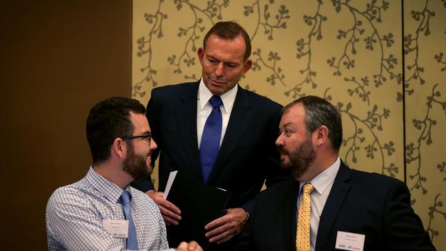 Trent Twomey, Advance Cairns and Greg Ireland, NT Chamber of Commerce with former Prime Minister Tony Abbott in 2015. Picture: Marc McCormack