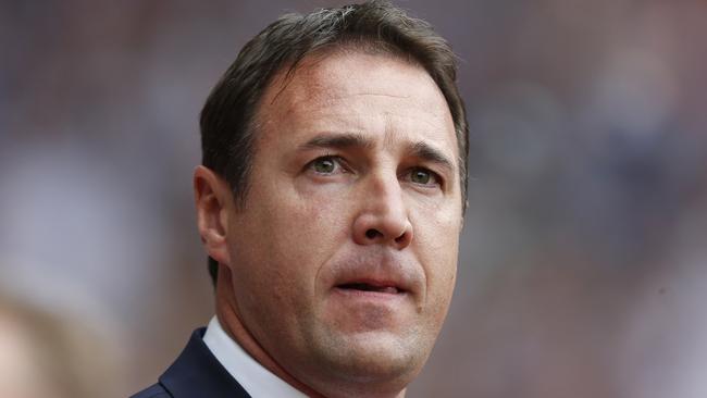 FILE - This is a Saturday, Aug. 17, 2013 file photo of the then Cardiff City's manager Malky Mackay as he looks on from the dugout before the start of their English Premier League soccer match against West Ham United at Upton Park, London. The English Football Association siad Thursday Aug. 21, 2014 that it has opened an investigation after Cardiff submitted a dossier to the governing body about the conduct of former manager Malky Mackay and a member of his backroom staff. (AP Photo/Sang Tan/ File)