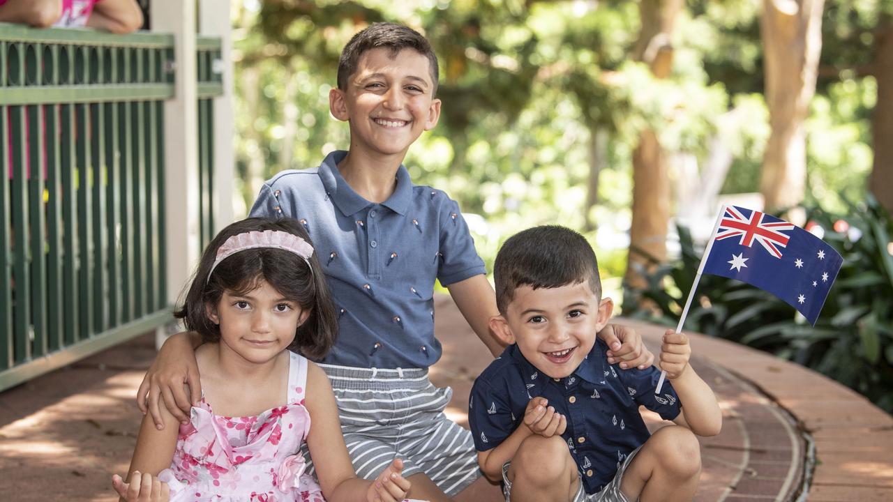 (from left) Ciemav, Othman and Stefan Joweesh enjoy a pizza at the Australia Day celebrations at Picnic Point in Toowoomba. Thursday, January 26, 2023. Picture: Nev Madsen.