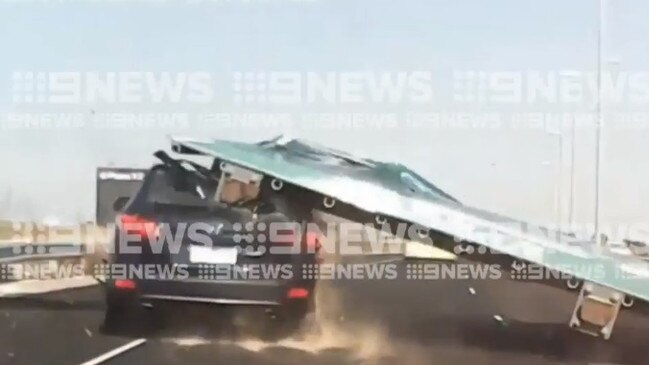 The moment a sign fell on a car on the Tullamarine Freeway. Picture: 9 News Melbourne