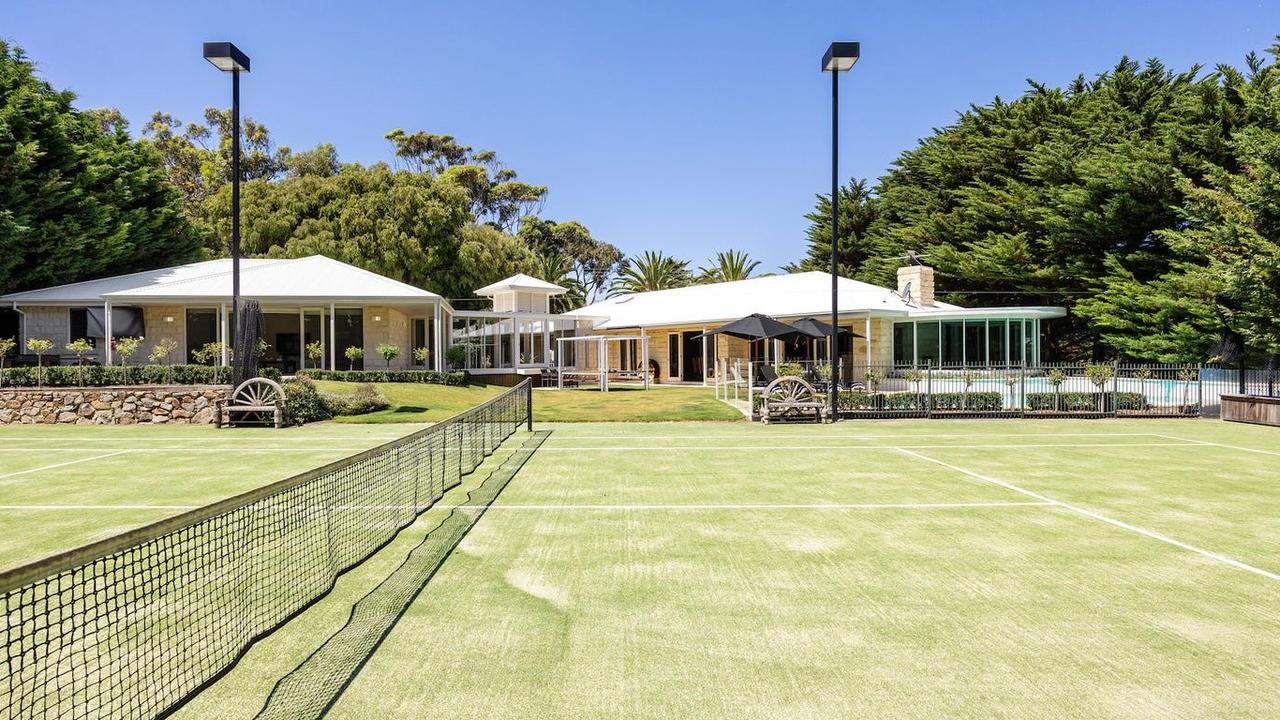 The tennis court has a north-south orientation.