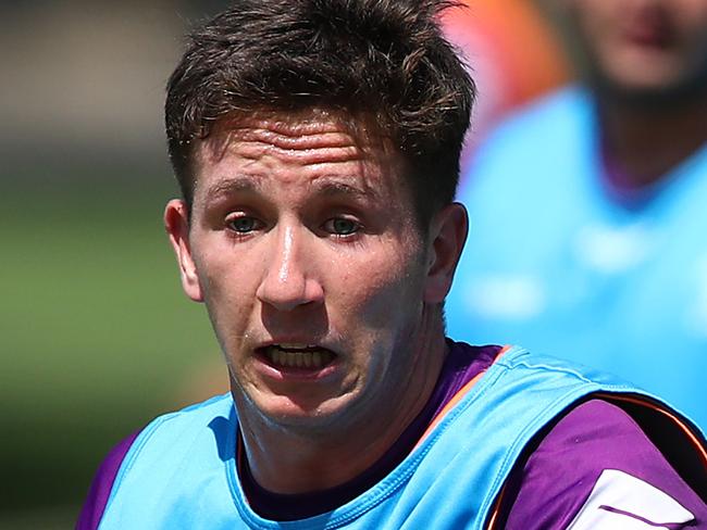 MELBOURNE, AUSTRALIA - FEBRUARY 04: Cooper Johns runs with the ball during a Melbourne Storm NRL media opportunity & training session at Gosch's Paddock on February 04, 2020 in Melbourne, Australia. (Photo by Kelly Defina/Getty Images)