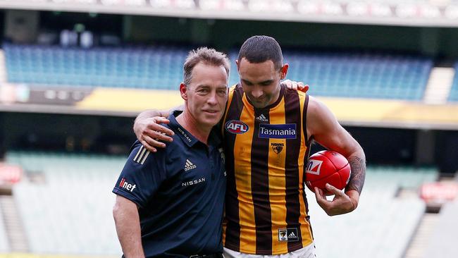 Alastair Clarkson and Shaun Burgoyne walk off the MCG together. Photo by Michael Klein.