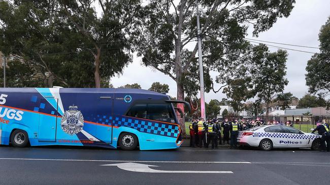 A heavy police presence on Saturday afternoon in North Melbourne after the immediate lockdown began. Picture: Ian Currie