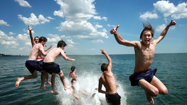 Melburnians soak up the sunshine enjoying a dip at the South Melbourne Beach and Kerford Rd Pier. Wesley College Yr 9 students take the plunge.