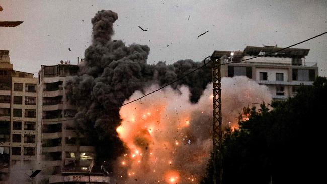 A fireball erupts from the site of an Israeli airstrike that targeted the area of Tayouneh in Beirut's southern suburbs on November 25. Picture: AFP