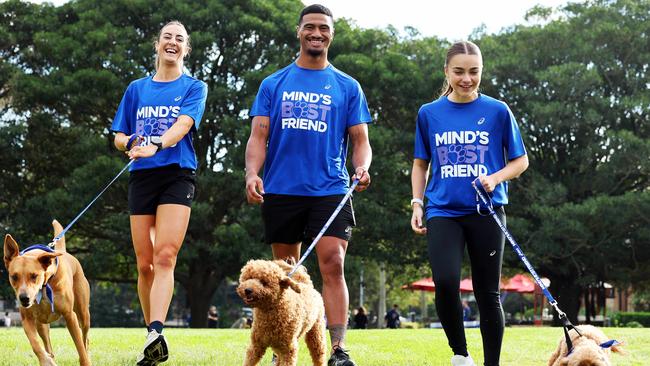 ASICS Ambassadors and athletes, elite long distance runner Leanne Pompeani and dog Kobe, Cronulla Sharks player Ronaldo Mulitalo and dog Kobe, and Western Sydney Wanderers player Amy Chessari and dog Benson. Picture: Tim Hunter.
