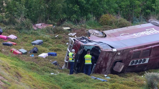 A school bus carrying 32 people flipped on the Western Highway in Bacchus Marsh. Photo: Brendan Beckett