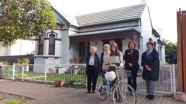 Norwood residents Rowena Dunk, Brigitte Squire, Bridie Squire, Sue Whittington and Fay Patterson outside one of the homes. Picture: Renato Castello