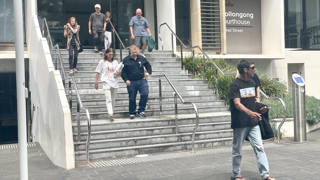 “Guru” (r) leaves Wollongong Local Court with some of his supporters. Picture: News.com.au