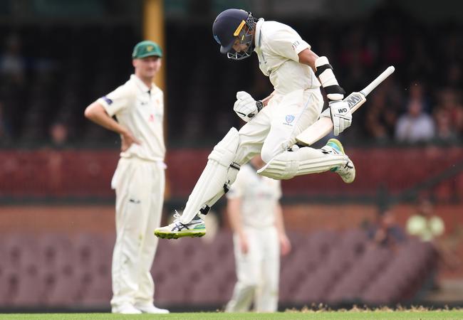 Jason Sangha celebrates a recent Sheffield Shield century.