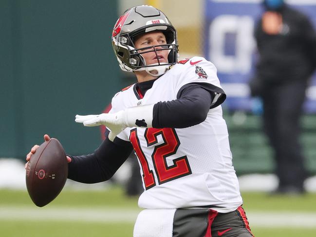 GREEN BAY, WISCONSIN - JANUARY 24: Tom Brady #12 of the Tampa Bay Buccaneers warms up prior to their NFC Championship game against the Green Bay Packers at Lambeau Field on January 24, 2021 in Green Bay, Wisconsin. (Photo by Stacy Revere/Getty Images)