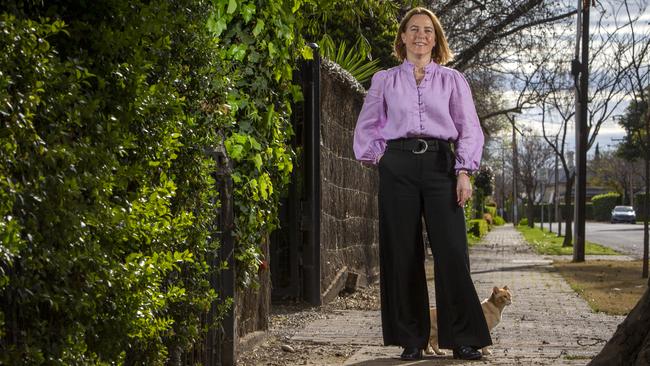 Jane Burton and Fred the cat outside her family home at 16 Avenel Gardens Rd in Medindie. Picture: Emma Brasier.