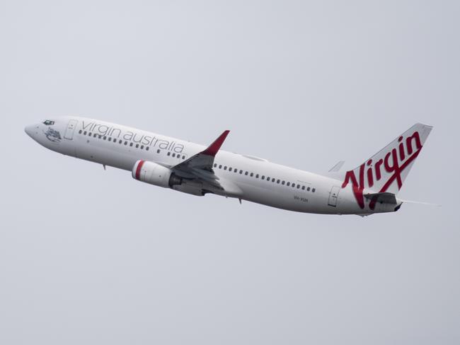 SYDNEY, AUSTRALIA - NewsWire Photos May 6, 2021: A Virgin Australia aircraft taking off at Sydney Airport.Picture: NCA NewsWire / James Gourley