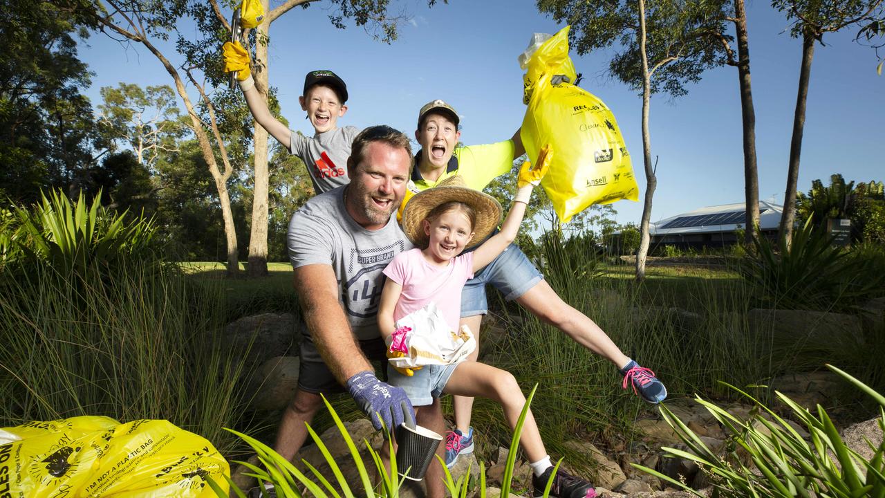 The Mercer family – dad Tony, mum Liz and kids Lachlan, 9, and Abigail, 6 – volunteer for Clean Up Australia Day at Brookhaven in Queensland in 2021. Picture: Renae Droop/RDW Photography