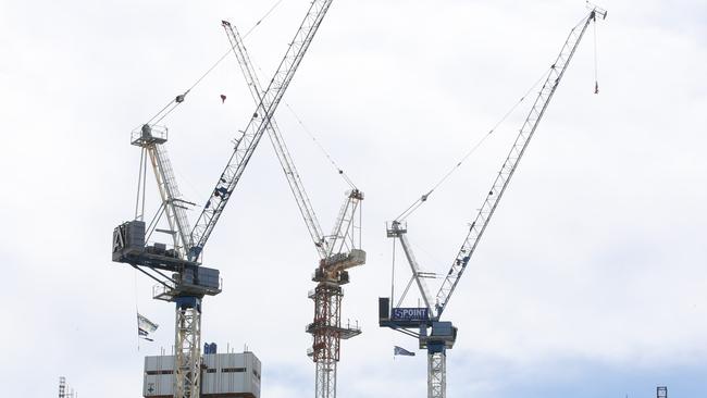 High-rise development, towers and cranes dominate the Main Beach skyline over the Norfolk Pines. Picture Glenn Hampson