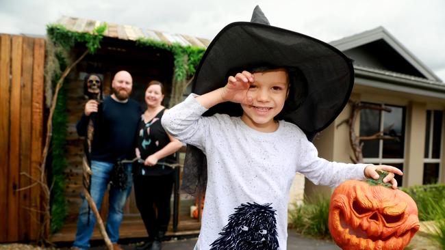 Harrison Domotor, 3, with his parents Michael and Priscilla at their Halloween house in Caddens. Picture: Angelo Velardo