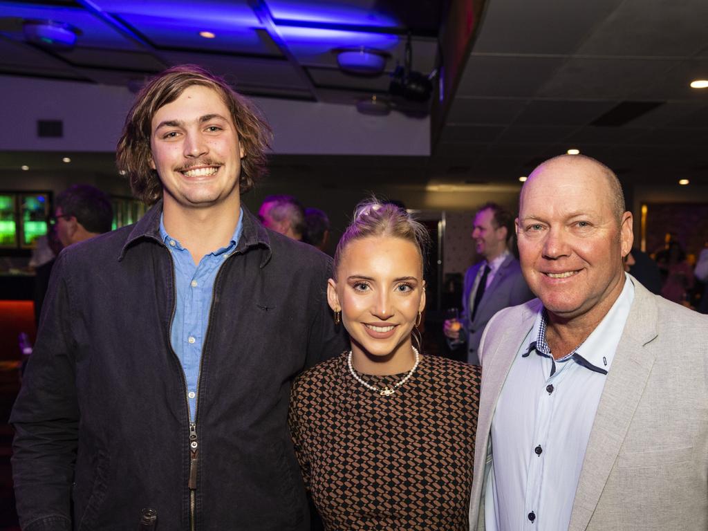 Downs and Western Housing and Construction Awards hostess Maddy Davies with Lincoln Adams (left) and Mark Davies at Rumours International, Friday, July 22, 2022. Picture: Kevin Farmer