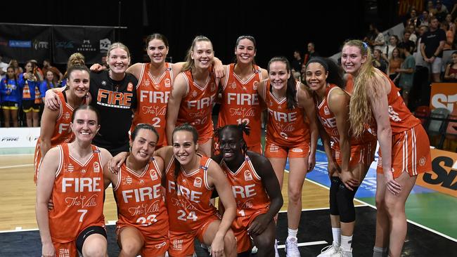 TOWNSVILLE, AUSTRALIA – FEBRUARY 26: The Fire pose for a photo after winning game two of the WNBL Semi Final series between Townsville Fire and Perth Lynx at Townsville Entertainment Centre, on February 26, 2025, in Townsville, Australia. (Photo by Ian Hitchcock/Getty Images)