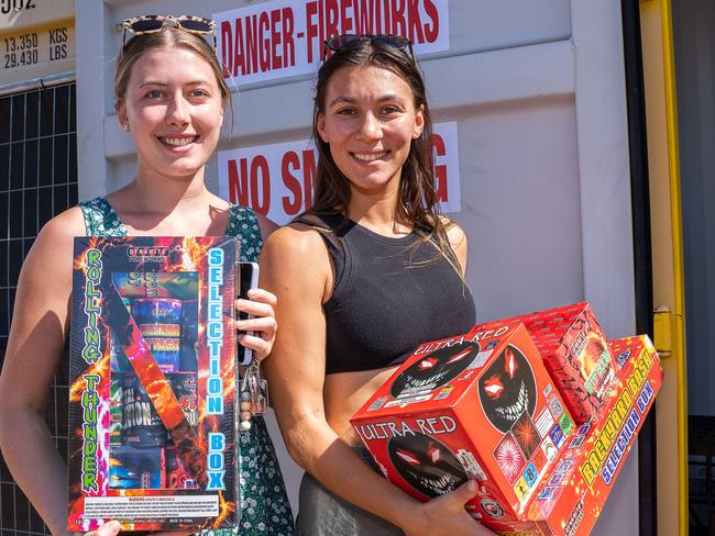 Karla Hobson and Hunter Halkim are stocking up with fireworks ahead of an explosive night of fun on Territory Day. Picture: Pema Tamang Pakhrin