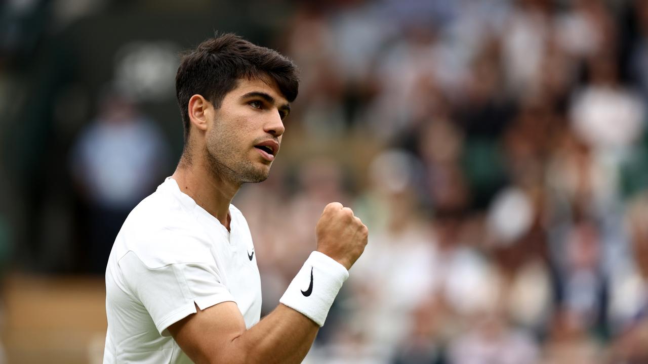 LONDON, ENGLAND – JULY 03: Carlos Alcaraz of Spain celebrates winning match point against Aleksandar Vukic of Australia in his Gentlemen's Singles second round match during day three of The Championships Wimbledon 2024 at All England Lawn Tennis and Croquet Club on July 03, 2024 in London, England. (Photo by Francois Nel/Getty Images)