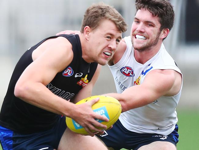 MELBOURNE, AUSTRALIA - FEBRUARY 20: Jackson Macrae is tackled by Bailey Williams during the Western Bulldogs Intra-club match session at Whitten Oval on February 20, 2019 in Melbourne, Australia. (Photo by Michael Dodge/Getty Images)