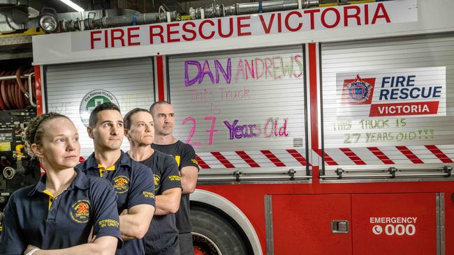 Firefighters John Shane Tracey and Megan are part of many fire fighters who will be plastering anti-Dan messages on their trucks. Picture: Tony Gough