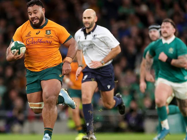 DUBLIN, IRELAND - NOVEMBER 30: Taniela Tupou of Australia runs with the ball during the Autumn Nations Series 2024 match between Ireland and Australia at Aviva Stadium on November 30, 2024 in Dublin, Ireland. (Photo by David Rogers/Getty Images)