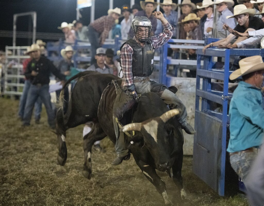 Local Ehtan McConnell rides in the top eight chute out at the Lawrence Twilight Rodeo. Picture: Adam Hourigan