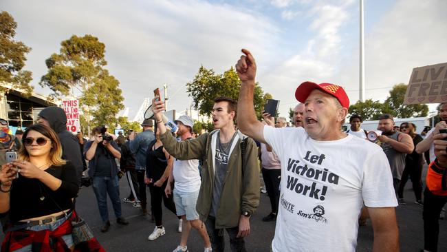 Anti-lockdown protesters march to the Australian open at Melbourne Park on Friday evening Picture: David Geraghty