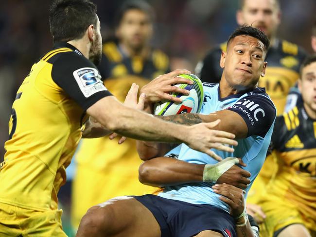 SYDNEY, AUSTRALIA - JULY 09: Israel Folau of the Waratahs heads for the tryline during the round 16 Super Rugby match between the Waratahs and the Hurricanes at Allianz Stadium on July 9, 2016 in Sydney, Australia. (Photo by Cameron Spencer/Getty Images)